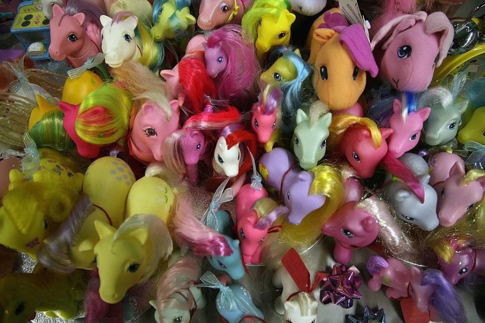 An assortment of colorful My Little Pony toys, featuring various styles and poses, is densely packed together