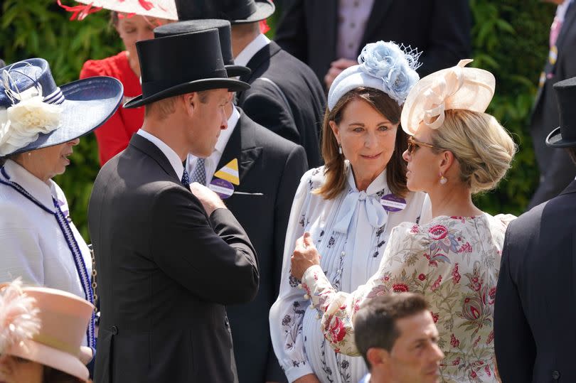 Prince William speaks to his mother in law Carole Middleton and cousin Zara Tindall at Ascot