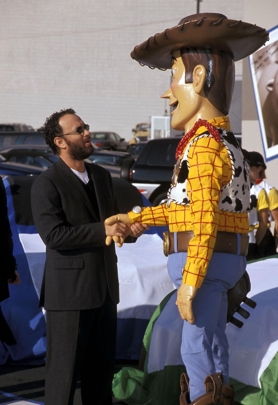 Actor Tom Hanks and Woody attend the "Toy Story 2" Themed NASCAR Racing Cars Unveiling on October 23, 1999 at the El Capitan Theatre in Hollywood, California. (Photo by Ron Galella, Ltd./Ron Galella Collection via Getty Images)