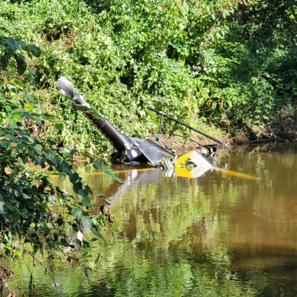 The single-engine Robinson R22 crashed in woods and a stream off Lakeview Avenue. The pilot was killed.