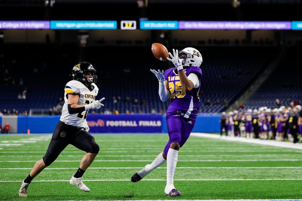 Warren De La Salle wide receiver Triston Nichols makes a catch for a touchdown against Traverse City Central defensive back Brayden Halliday during the first half of the Division 2 state final on Friday, Nov. 26, 2021, at Ford Field.