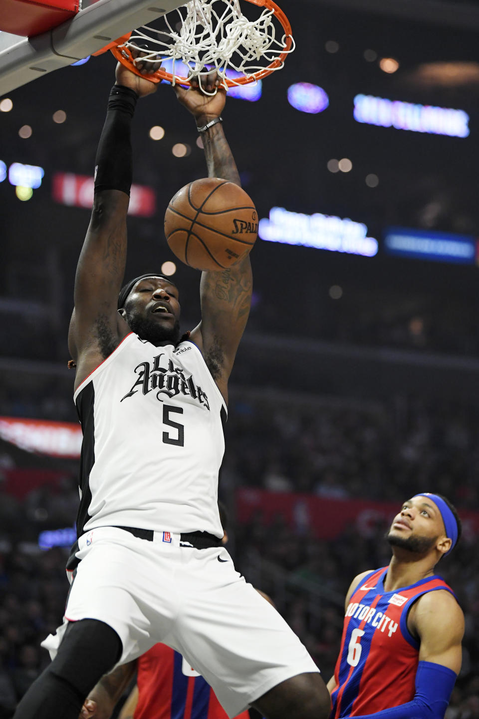 Los Angeles Clippers forward Montrezl Harrell dunks as Detroit Pistons guard Bruce Brown watches during the first half of an NBA basketball game Thursday, Jan. 2, 2020, in Los Angeles. (AP Photo/Mark J. Terrill)