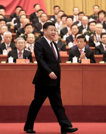 Chinese President Xi Jinping walks to the lectern to deliver his speech during the opening session of the 19th National Congress of the Communist Party of China at the Great Hall of the People in Beijing, China October 18, 2017. Picture taken October 18, 2017. China Daily via REUTERS/Files