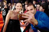 Caitriona Balfe smiles for selfies with fans at the <em>Ford v Ferrari</em> premiere during the 63rd BFI London Film Festival at Odeon Luxe Leicester Square on Thursday.