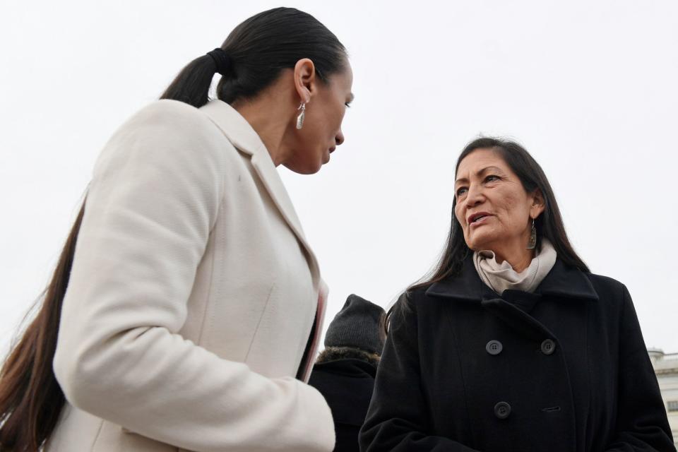 Rep. Deb Haaland, right, talks with Rep. Sharice Davids outside the Capitol on Jan. 4, 2019, the day after the two were sworn in as the first Native women members of Congress.