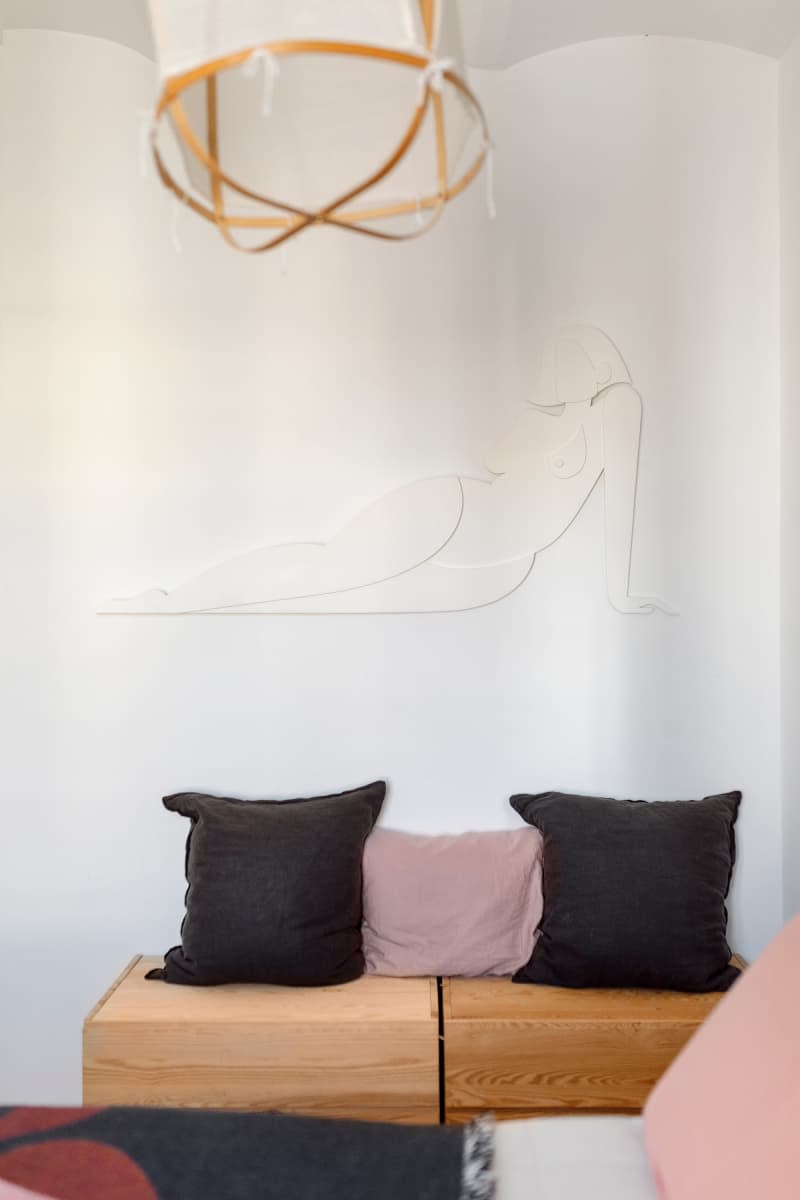 Sitting area below wall art.