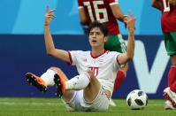 <p>‘He’s been doing it all day’: Iran’s Sardar Azmoun calls for a yellow card from the referee after he was brought down by a Moroccan player. EFE/EPA/GEORGI LICOVSKI </p>