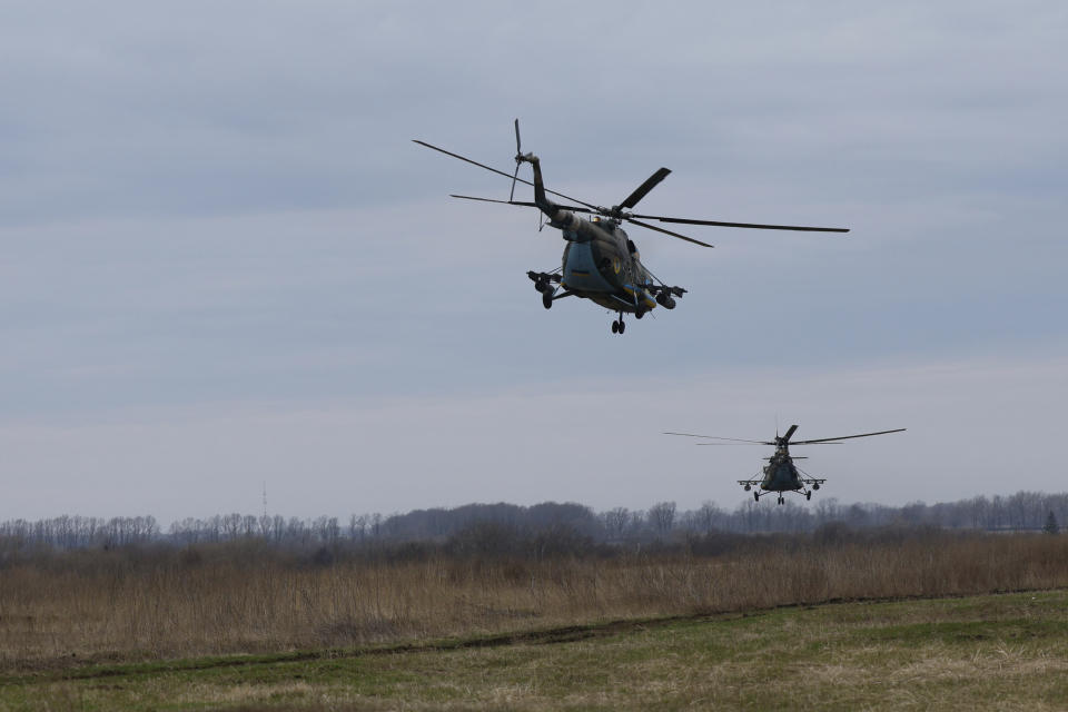 Ukrainian Mi-8 combat helicopters of 12 aviation brigade fly towards Russian positions during a combat mission in Kharkiv region, Ukraine, Sunday, April 2, 2023. (AP Photo/Alex Babenko)