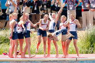 WINDSOR, ENGLAND - AUGUST 02: The United States team throw their cox Mary Whipple into the water as they celebrate with their gold medals during the medal ceremony after the Women's Eight final on Day 6 of the London 2012 Olympic Games at Eton Dorney on August 2, 2012 in Windsor, England. (Photo by Jamie Squire/Getty Images)