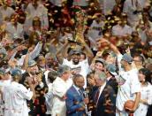 NBA Finals MVP LeBron James of the Miami Heat holds the championship trophy after defeating the Oklahoma City Thunder in Game Five of the NBA Finals, on June 21, at the American Airlines Arena in Miami, Florida. The Heat won 121-106 to capture the best-of-seven championship series four games to one