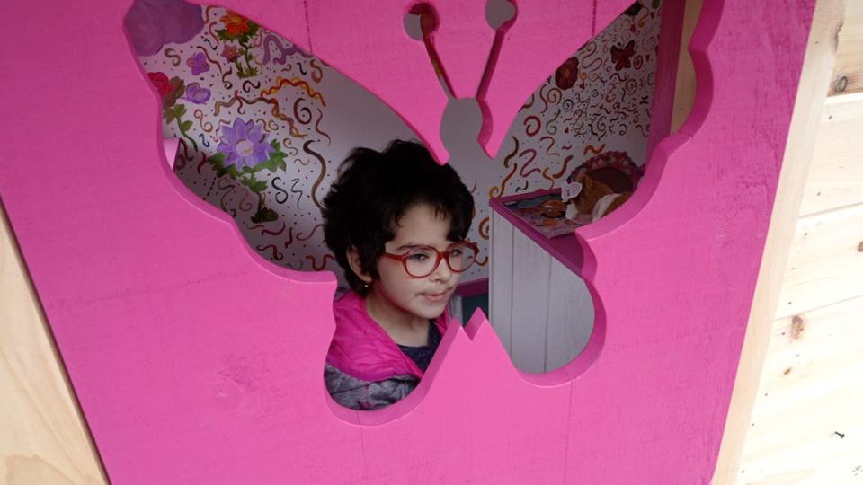 Raelyn Augusto in her new playhouse. 