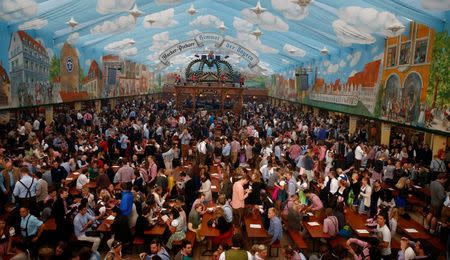 Customers fill a tent after the opening of the 182nd Oktoberfest in Munich, Germany, September 19, 2015. REUTERS/Michael Dalder/File Photo