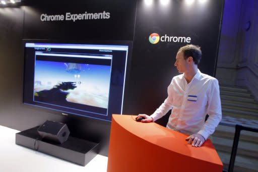 An employee stands next to a giant screen for "Chrome Experiments" in the Google France offices in 2011 in Paris before its inauguration. Google stepped up its effort earlier this year by releasing a full version of its Chrome browser for mobile devices, which will over time replace the unnamed browser on devices powered by Google's open Android platform