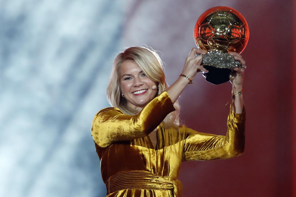 FILE - In this Dec. 3, 2018, file photo, Olympique Lyonnais soccer player Ada Hegerberg celebrates with the Women's Ballon d'Or award during the Golden Ball award ceremony at the Grand Palais in Paris, France. The world’s best player won’t be at the Women’s World Cup. Hegerberg stepped away in 2017 because of what she perceives to be a general disregard for women’s soccer by the country’s federation. (AP Photo/Christophe Ena, File)