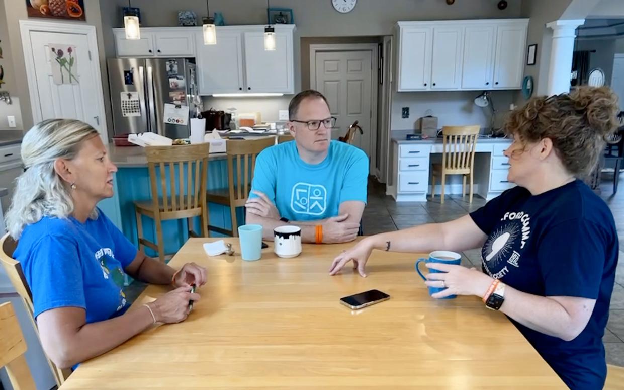 Author Tricia Heyer, right, talks to Jason and Amy Kolb about the book she's collaborating with Jason on to tell the story of the skiing accident that left him paralyzed and the faith that helped sustain him through this devastating injury.