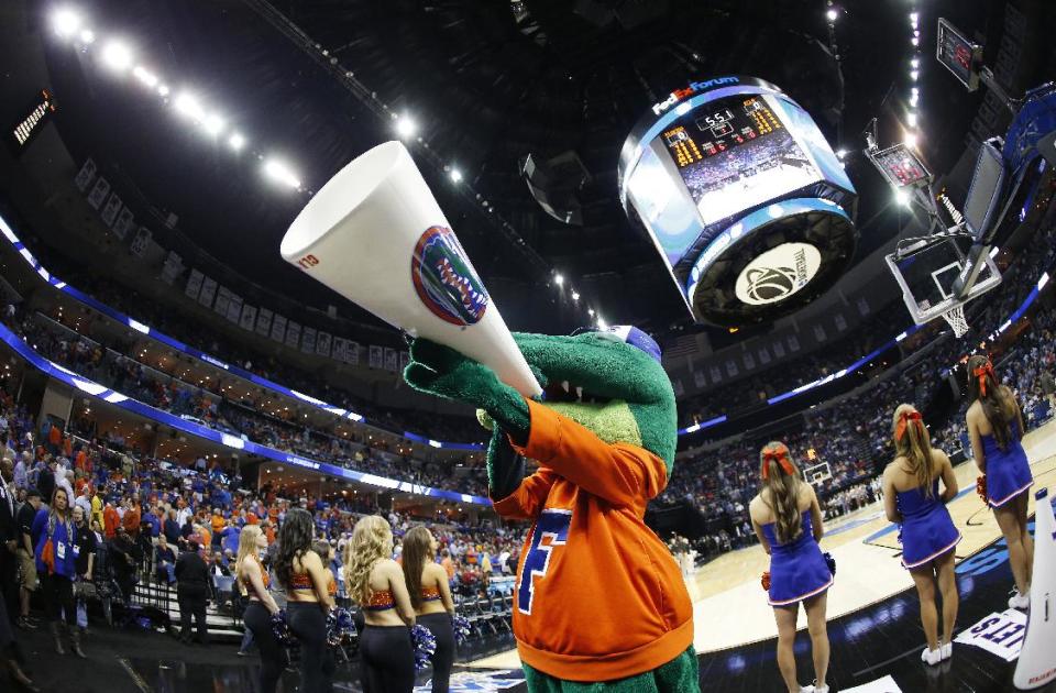 The Florida mascot cheers before the first half in a regional semifinal game against UCLA at the NCAA college basketball tournament, Thursday, March 27, 2014, in Memphis, Tenn. (AP Photo/John Bazemore)