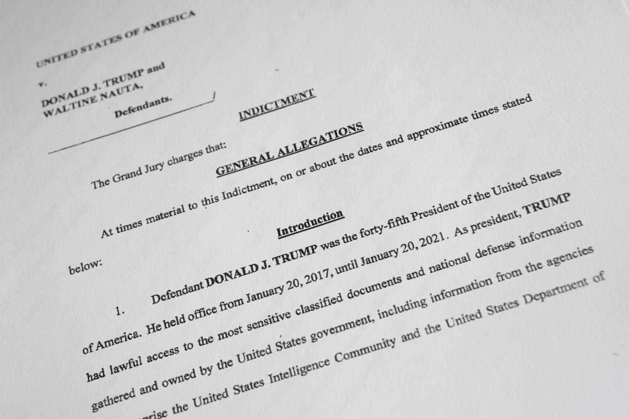 A photo shows a copy of the indictment of former President Donald Trump and Trump aide Waltine Nauta, brought by the United States Justice Department. Former President Trump was charged with multiple counts in a 49 page indictment.