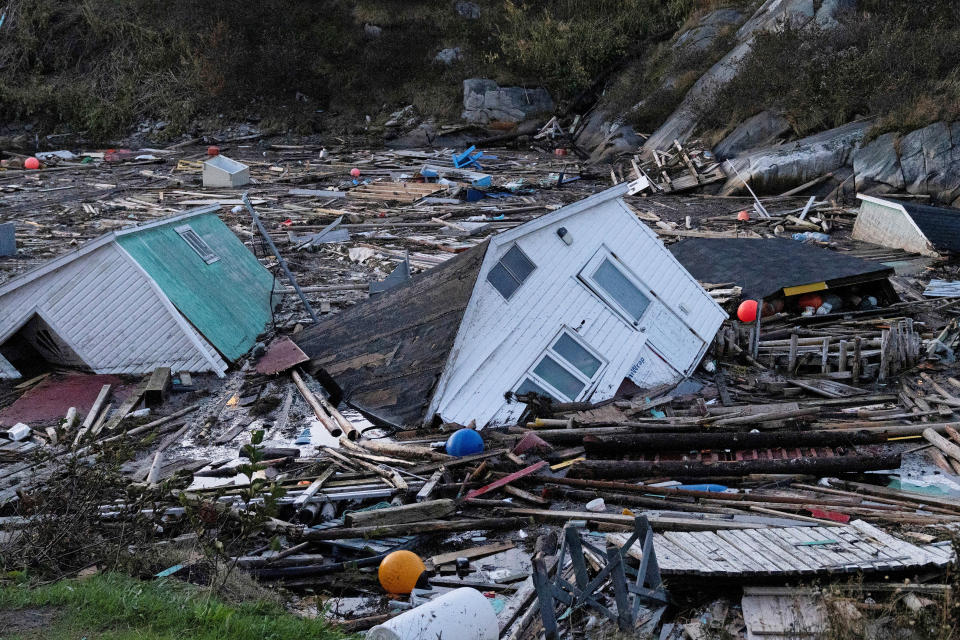 <p>Structures float in the water in the aftermath of Hurricane Fiona in Rose Blanche, Newfoundland, Canada September 25, 2022. REUTERS/John Morris</p> 