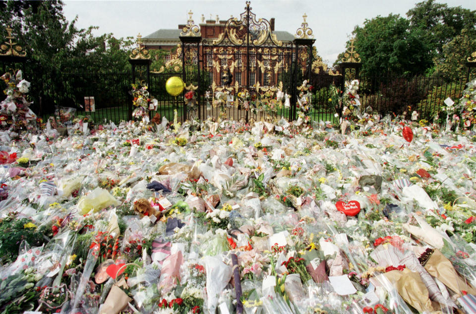 Thousands of flowers cover the gate entrance of Kensington Palace,  September 1, a day after the announcement of Princess Diana's death. [Many Londoners stopped off at Kensington Palace on their way to work to pay respects to Princess Diana who was killed in a car accident in Paris, August 31, with her friend Dodi Al Fayed and a chauffer].