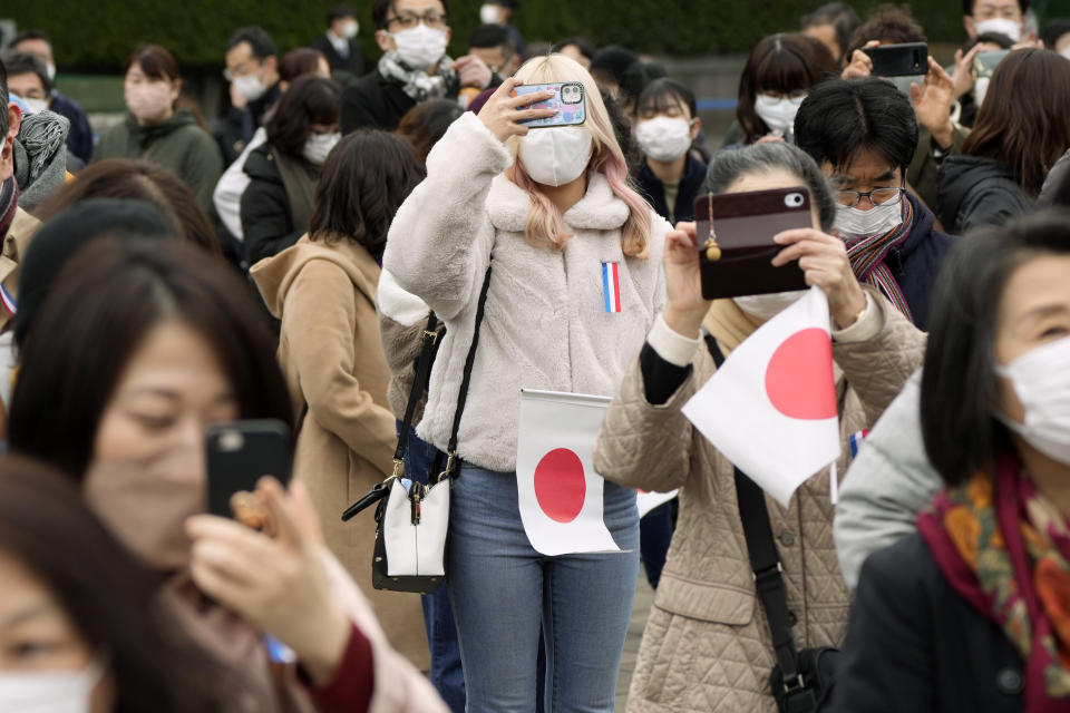 Well-wishers wait to see Japan's Emperor Naruhito appear during his 63rd birthday celebration at the Imperial Palace in Tokyo, Thursday, Feb. 23, 2023. (AP Photo/Eugene Hoshiko, Pool)