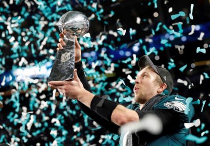 NFL Football - Philadelphia Eagles v New England Patriots - Super Bowl LII - U.S. Bank Stadium, Minneapolis, Minnesota, U.S. - February 4, 2018  Philadelphia Eagles' Nick Foles celebrates with the Vince Lombardi Trophy after winning Super Bowl LII  REUTERS/Kevin Lamarque