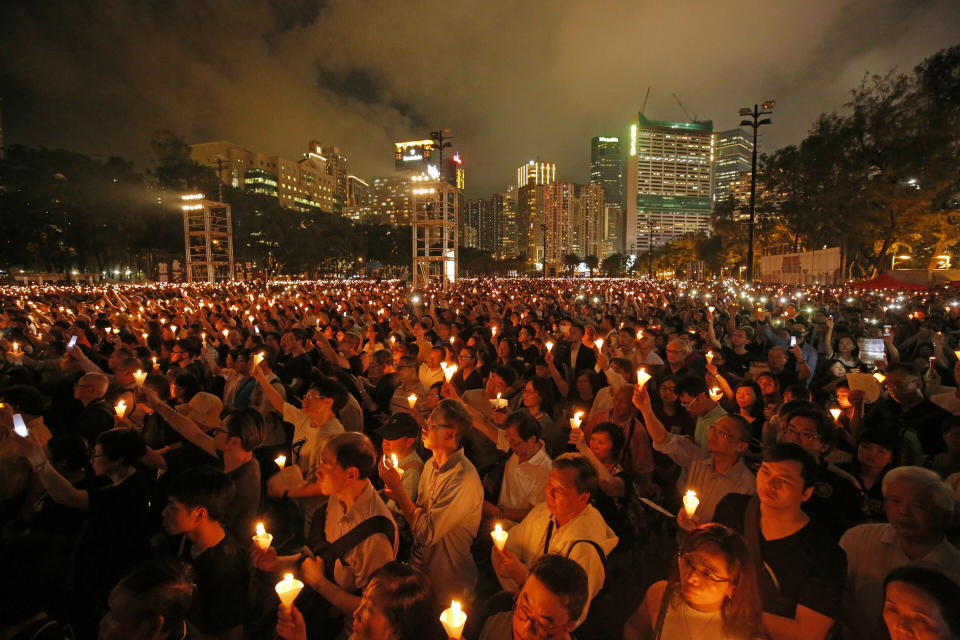 FILE - Thousands of people attend a candlelight vigil for victims of the Chinese government's brutal military crackdown three decades ago on protesters in Beijing's Tiananmen Square at Victoria Park in Hong Kong, on June 4, 2019. As the 34th anniversary of China’s Tiananmen Square crackdown approaches Sunday, June 4, many in Hong Kong are trying to mark the day in their own ways in the shadow of a law that prosecuted many leading activists in the city’s pro-democracy movement. (AP Photo/Kin Cheung, File)