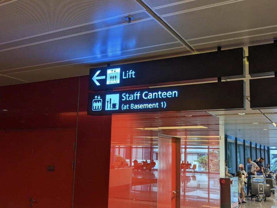 The sign pointing towards the staff canteen at Changi.