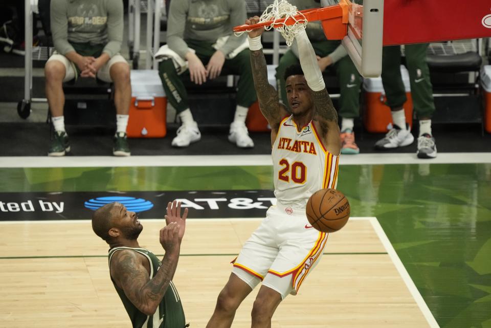 Atlanta Hawks' John Collins dunks during the second half of Game 1 of the NBA Eastern Conference basketball finals game against the Milwaukee Bucks Wednesday, June 23, 2021, in Milwaukee. (AP Photo/Morry Gash)