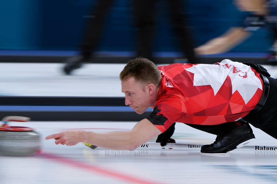 <p>Canada’s Marc Kennedy throws the stone during the curling men’s round robin session between Canada and Sweden during the Pyeongchang 2018 Winter Olympic Games at the Gangneung Curling Centre in Gangneung on February 17, 2018 </p>