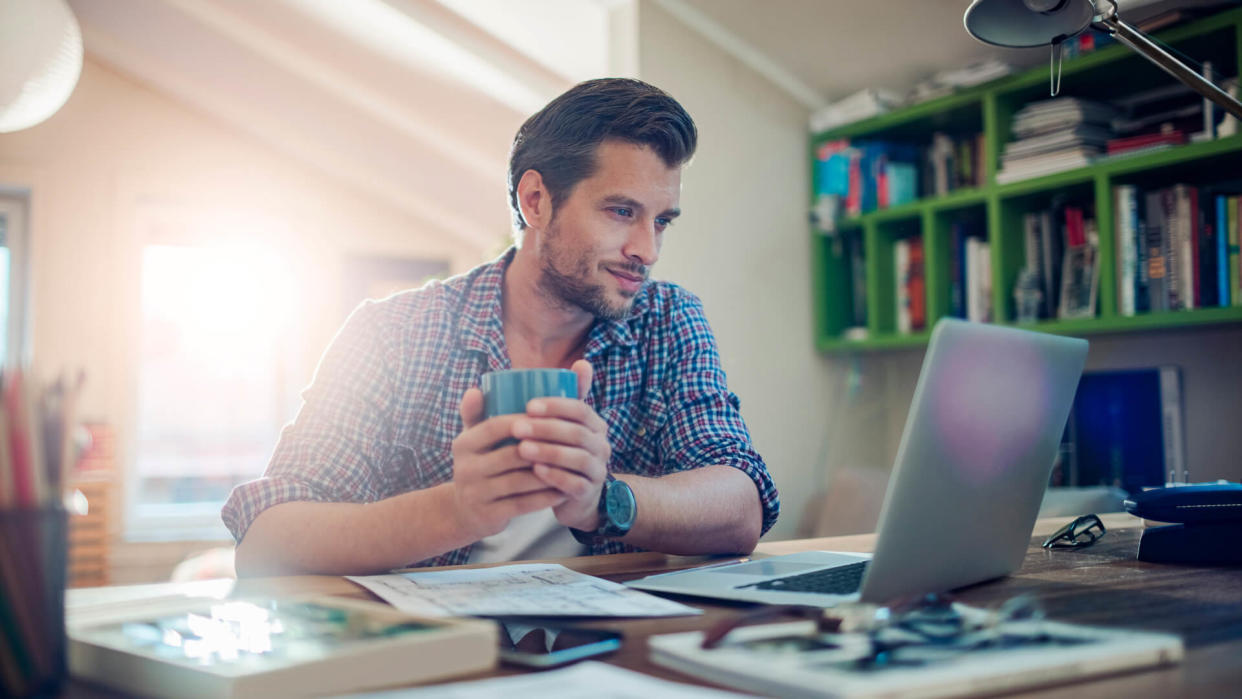 Photo of a man working from home.