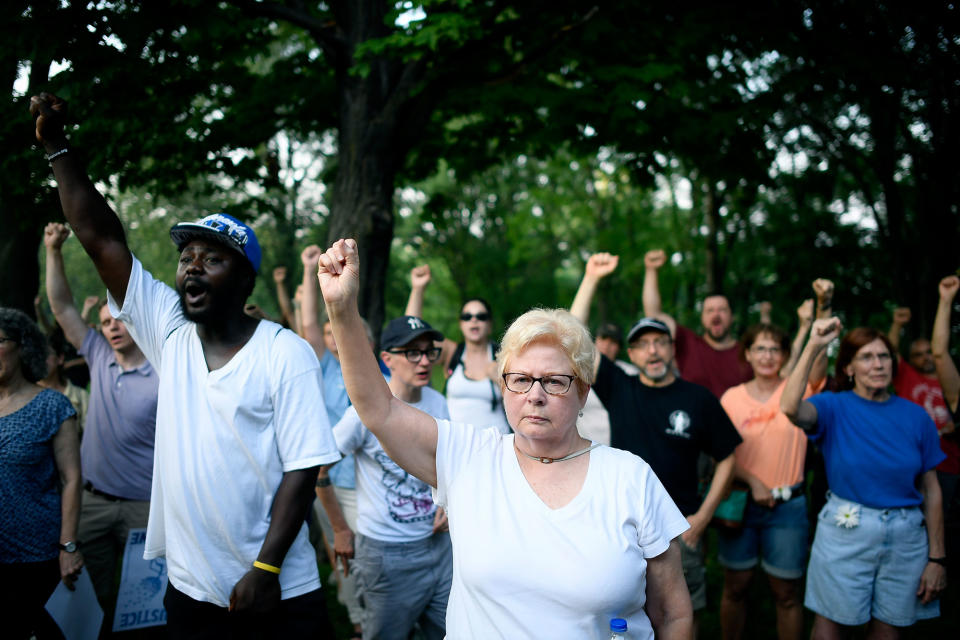 <p>Jan Skogstrom, of Minneapolis, raises her fist with fellow protesters during a march in honor of Justine Damond at Beard’s Plaissance Park, Thursday, July 20, 2017, in Minneapolis, Minn. (Photo: Aaron Lavinsky/Star Tribune via AP) </p>