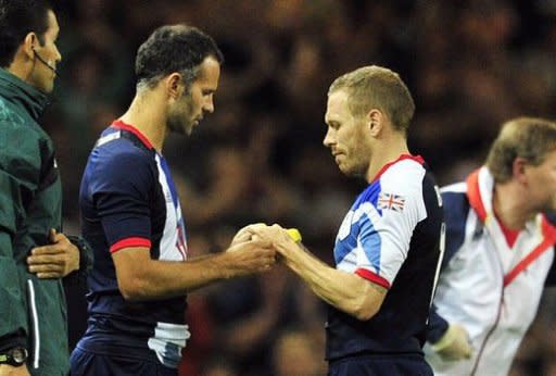 Britain's midfielder Ryan Giggs (L) comes on as a substitute for striker Craig Bellamy (R) during their London 2012 Olympic Games men's quarter-final football match against South Korea at the Millennium Stadium in Cardiff, Wales. Great Britain's first men's Olympic football tournament for more than 50 years ended in familiar fashion with an Englishman missing a penalty as they lost a shoot-out