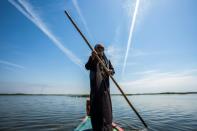 Ecotourism has helped revive the marshes -- Iraqis and foreigners take a raft trip down the river, stopping for lunch in a guesthouse