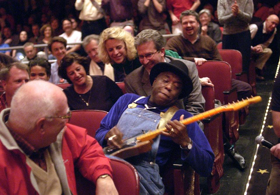 Blues legend Buddy Guy takes his act into the crowd during his performance at the Trustees Theater in March of 2005.