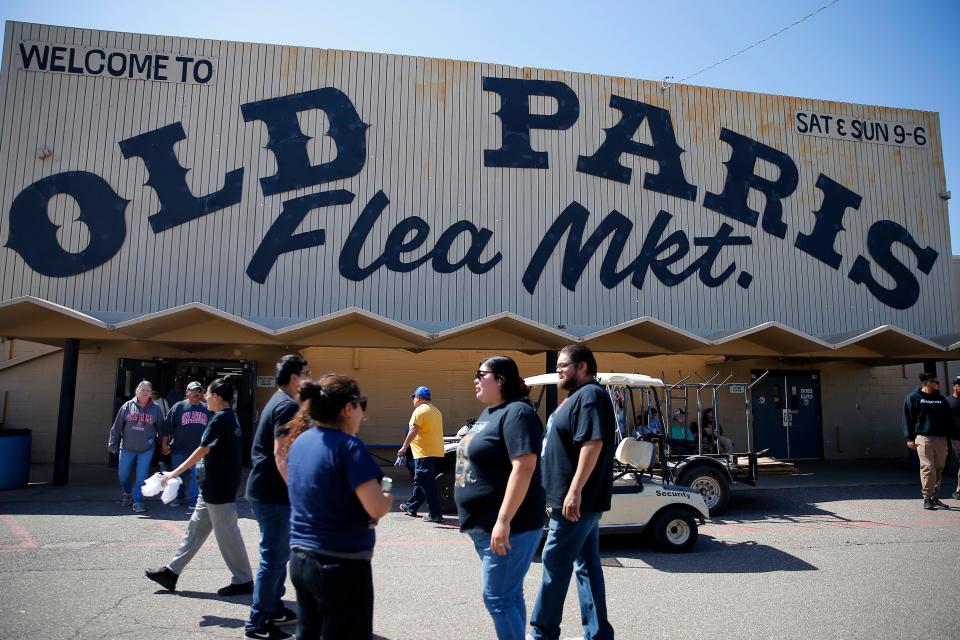Shoppers walk past the entry to Old Paris Flea Market in Oklahoma City.