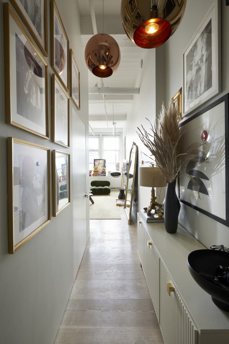 Art filled hallway in New York City apartment.