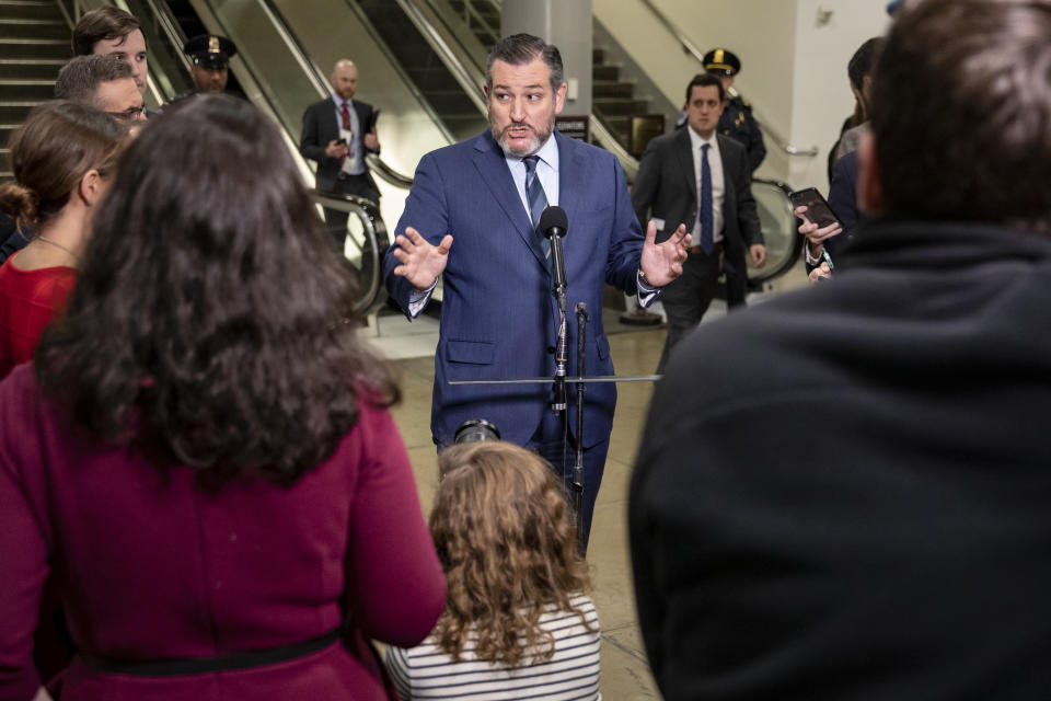 WASHINGTON, DC - JANUARY 29: U.S. Sen. Ted Cruz (R-TX) takes questions from reporters at the Senate subway during a recess in the Senate impeachment trial of President Donald Trump in the on January 29, 2020 in Washington, DC. Senators are submitting written questions to the House managers and the president's defense team in this phase of the trial in the senate. (Photo by Samuel Corum/Getty Images)