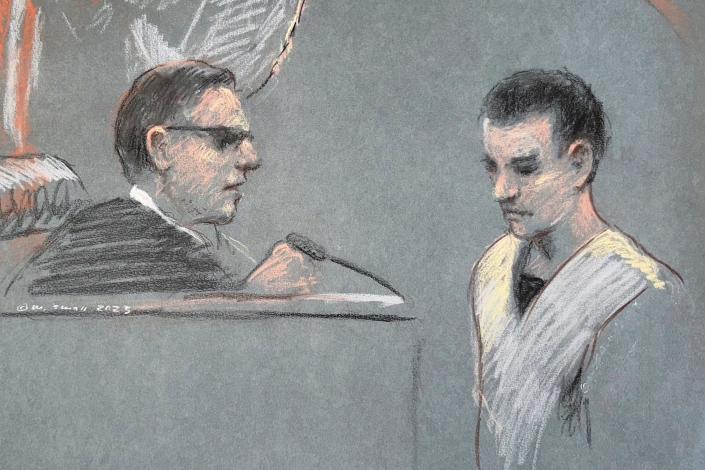 Massachusetts Air National Guardsman Jack Teixeira, right, appears in U.S. District Court in Boston, Friday, April 14, 2023. He is accused in the leak of highly classified military documents as prosecutors unsealed charges and revealed how billing records and interviews with social media comrades helped pinpoint Teixeira.
