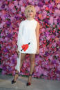 <p>Pixie Lott joined a gaggle of A-listers at the Schiaparelli haute couture show on 2 July in Paris. For the fashionable outing, the singer opted for a mini dress and pop of colour thanks to her co-ordinating lippy. <em>[Photo: Getty]</em> </p>