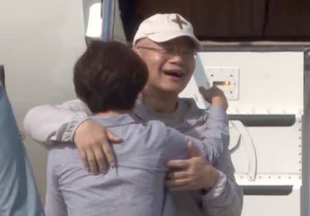 Rev. Hyeon Soo Lim, who was imprisoned in North Korea for more than two years, is seen reuniting with his wife Keum Young Lim (C) as he returned to Canada in this still image captured from a video in Toronto, Ontario, Canada, August 12, 2017. Courtesy Light Presbyterian Church/Handout via REUTERS