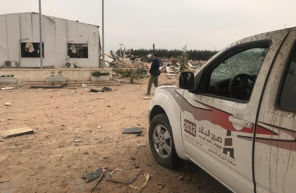 Destroyed buildings are seen at an airport complex under construction in Karbala, Iraq, Friday, March 13, 2020. Iraq's military said five security force members and a civilian were killed early Friday in a barrage of U.S. airstrikes, which were launched hours after a rocket attack killed and wounded American and British servicemen at a base north of Baghdad. (AP Photo/Anmar Khalil)