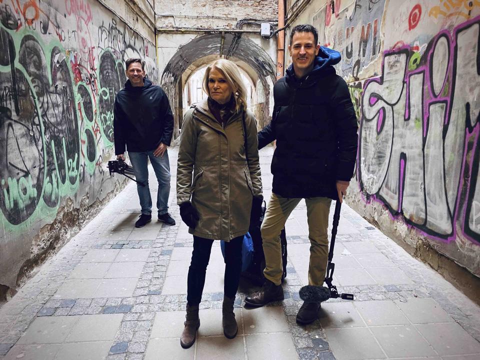 This image released by ABC shows Martha Raddatz, center, with Sam Sweeney and Yuriy Zalizniak, left, while on assignment in the Ukraine. (Scott Munro/ABC via AP)