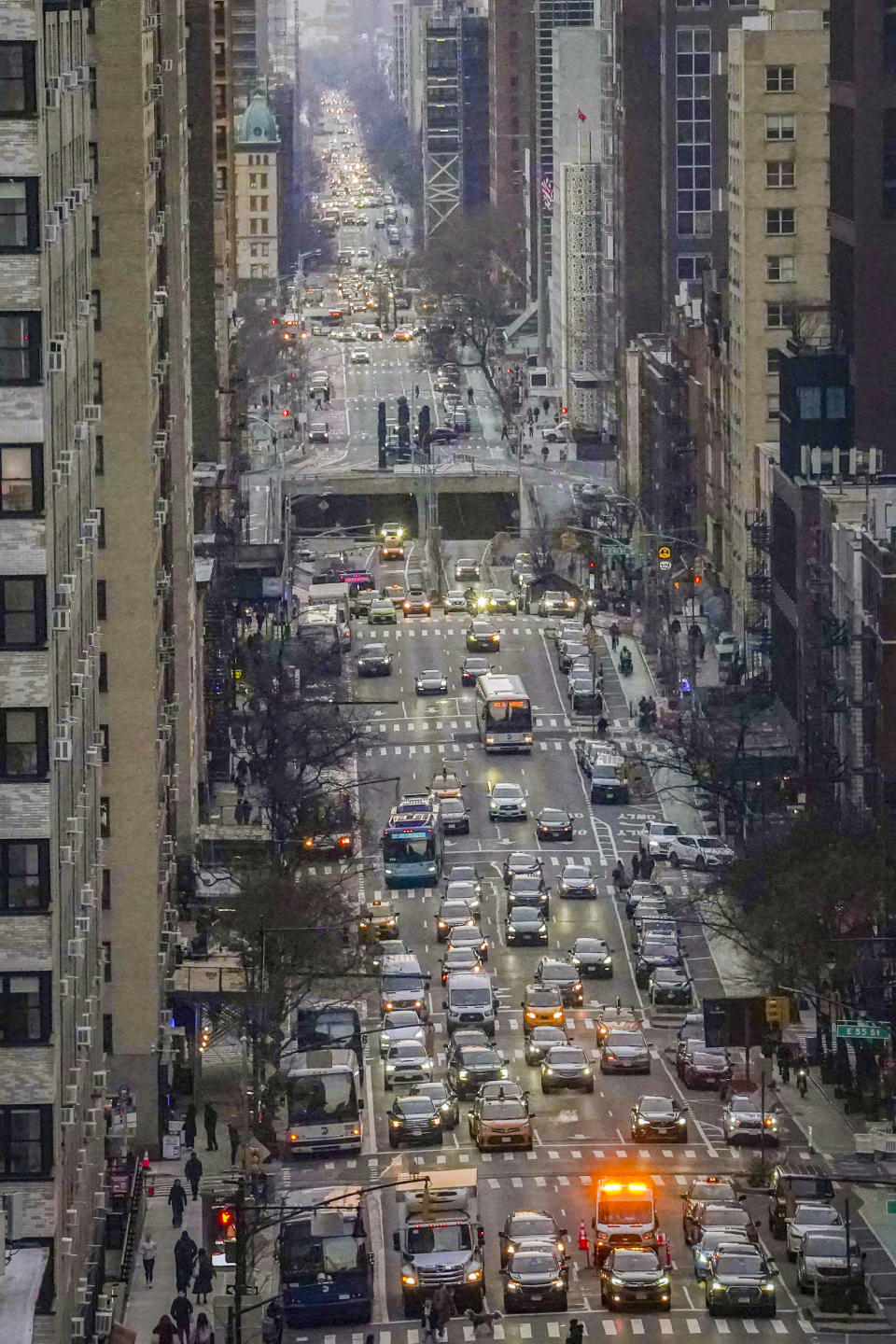 Traffic travels along First Avenue in midtown Manhattan, Thursday, Feb. 8, 2024, in New York. The Big Apple is close to implementing a plan that would use license-plate readers to turn all of Manhattan south of Central Park into one giant toll zone. (AP Photo/Bebeto Matthews)