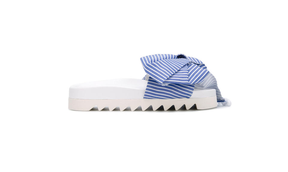 <p>Bow striped pool slides, $268, <a rel="nofollow noopener" href="https://www.farfetch.com/shopping/women/joshua-sanders-bow-striped-pool-slides-item-11994980.aspx?storeid=9334&from=search&ffref=lp_pic_164_47_" target="_blank" data-ylk="slk:farfetch.com;elm:context_link;itc:0;sec:content-canvas" class="link ">farfetch.com</a> </p>