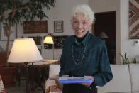 Get-out-the-vote letter writer Nancy Gehman poses for a photo at her home on Tuesday, Oct. 27, 2020, in Santa Fe, New Mexico. Gehman is one of 182,000 people who have participated in Vote Forward, a 50-state letter-writing campaign to more than 17.5 million homes. In the best of times, it’s a massive logistical challenge to get millions out to vote. In 2020, the difficulty has been dramatically compounded: by fear of the coronavirus, by complications and confusion over mail-in ballots, by palpable anxiety over the bitter divisions in the country. (AP Photo/Cedar Attanasio)