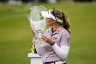 Brooke M. Henderson, of Canada, kisses the trophy after winning the ShopRite LPGA Classic golf tournament, Sunday, June 12, 2022, in Galloway, N.J. (AP Photo/Matt Rourke)