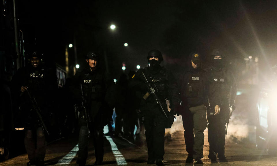 Police surround a Detroit warehouse where James and Jennifer Crumbley, the parents of the teenage gunman who carried out a 2021 attack at Oxford High School in Michigan, were arrested after the massacre. (Matthew Hatcher/Getty Images)