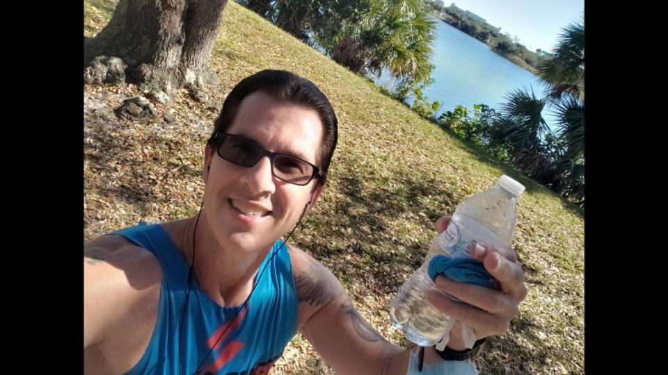 Chris Szynski of North Miami stops to take a selfie at Mile 9 of his #VirtuallyMiamiFamous half marathon he did Jan. 23, 2021 in Hollywood. The virtual race was created to replace the 2021 Life Time Miami Marathon and Half Marathon, which was canceled because of the COVID-19 pandemic.