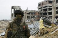 A pro-Russian separatist guards Donetsk International Airport in eastern Ukraine