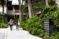 People walk through a business park at 1512 Broward Blvd., in Fort Lauderdale, Fla., on Thursday, March 28, 2024, where Campaign Nucleus's small, unmarked office is located. Political consultant Brad Parscale's company is boosting fundraising and voter engagement for the Trump campaign. (AP Photo/Lynne Sladky)